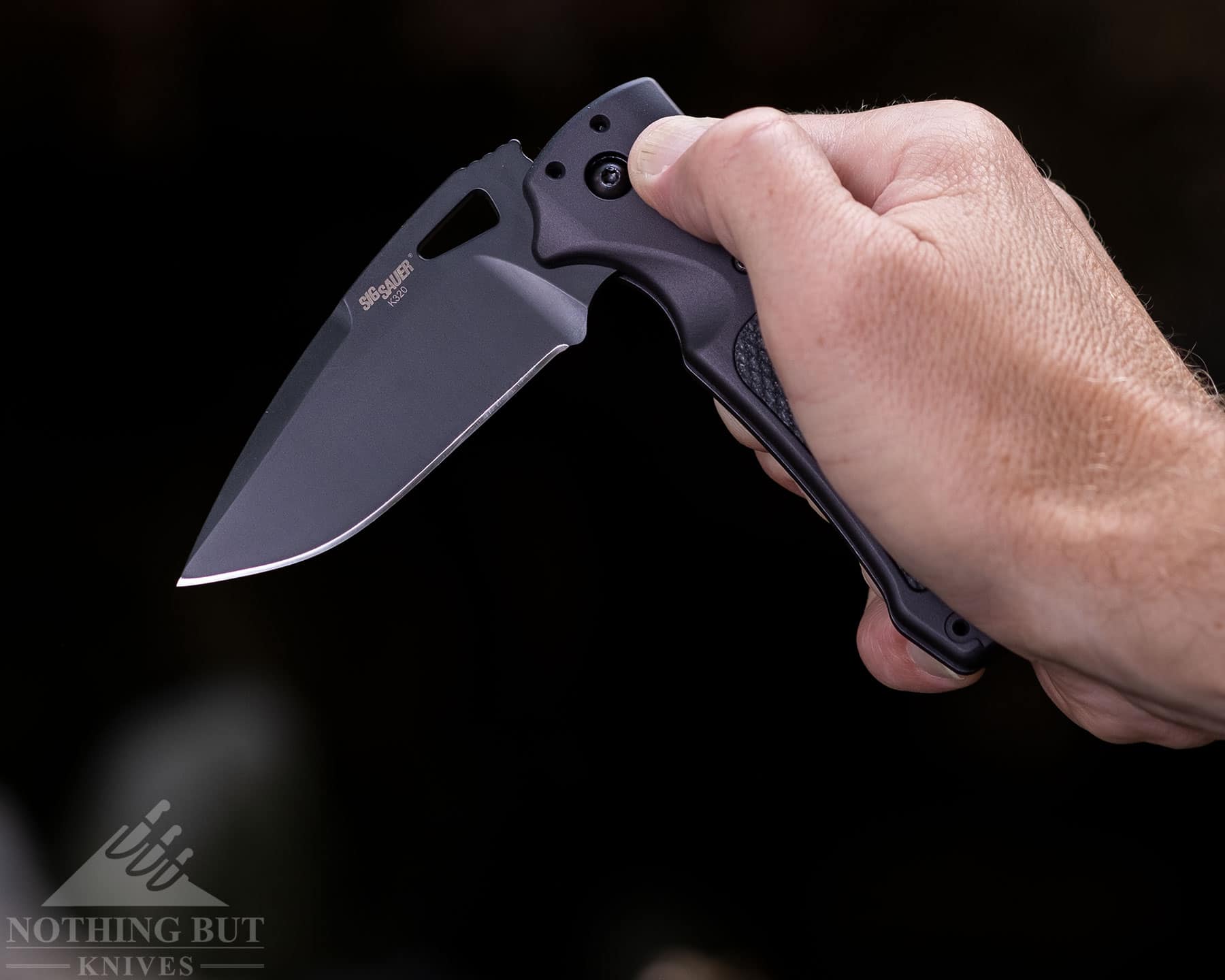 Activating the Able lock on the Hogue SIG K320 pocket knife is easy. 