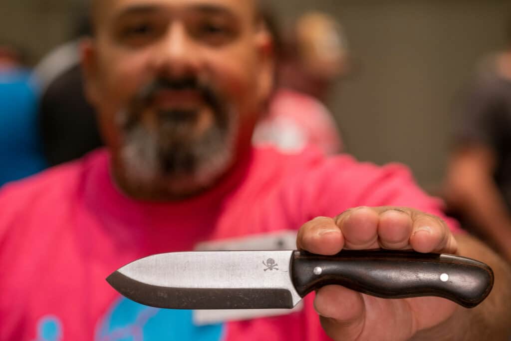 Julio Diez showing his new Cowcarta handle at Blade Show West 2022.