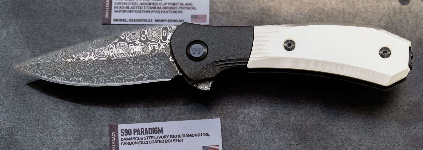 The Buck Paradigm in raindrop Damascus and ivory G10 scales.