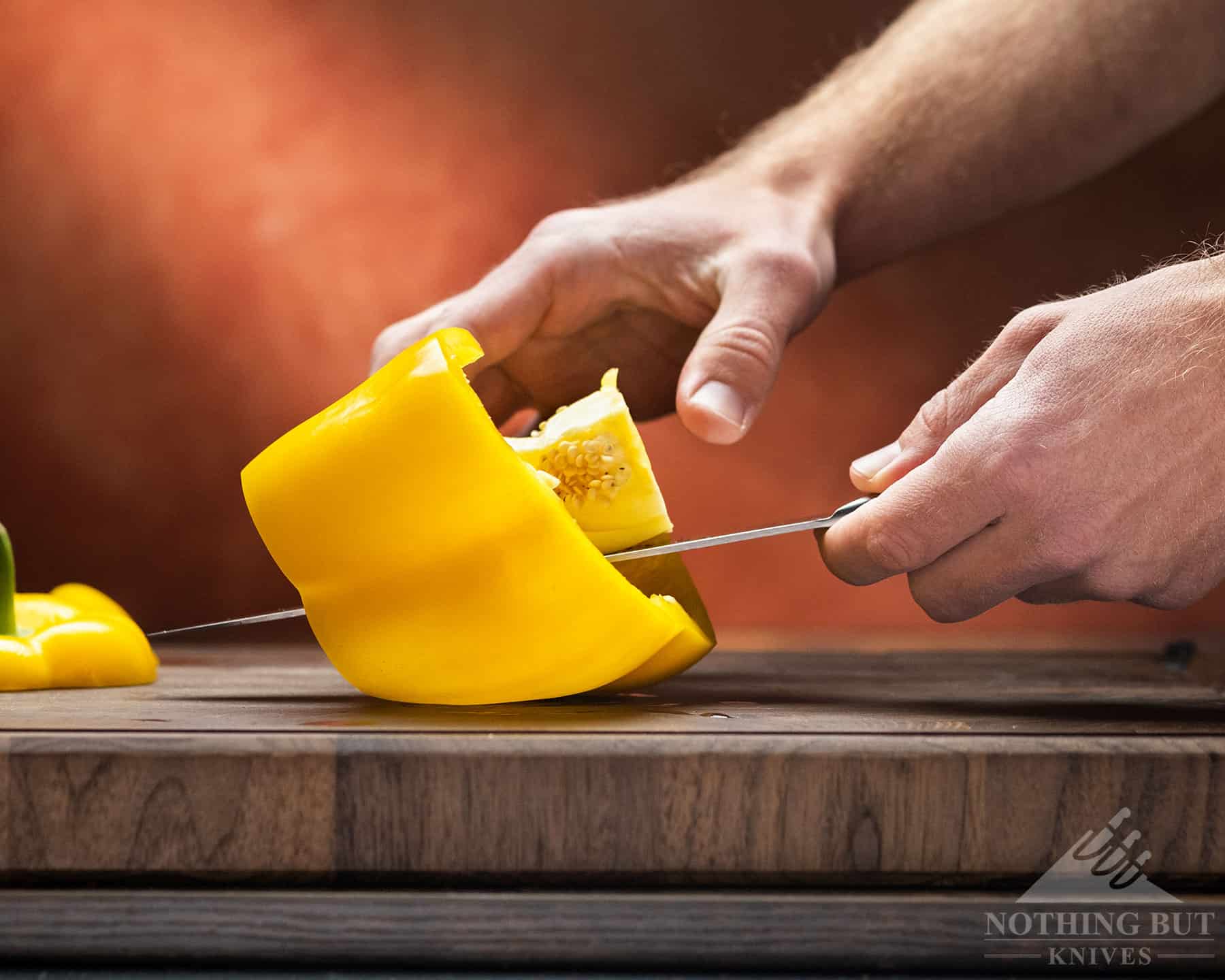 The Artisan chef knife slips a little when cutting peppers. 