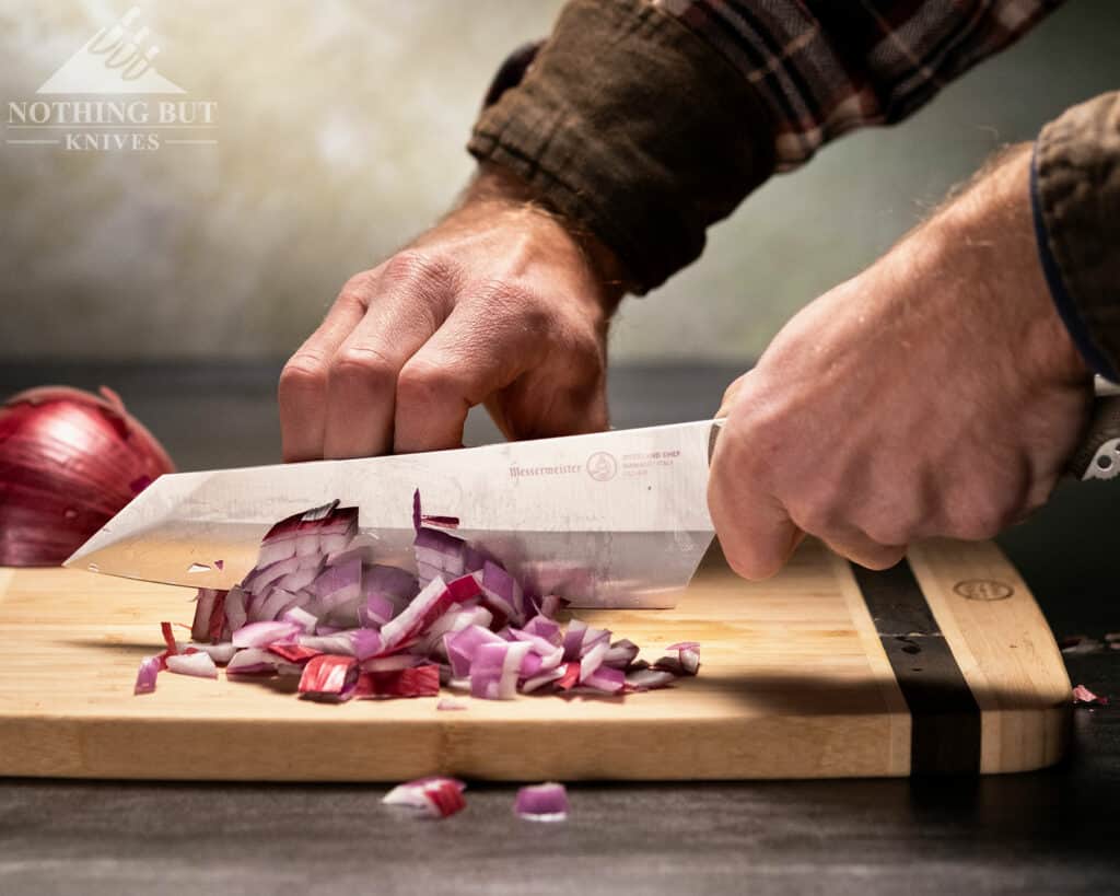 The Messermeister Overland chef knife handle is perfect for outdoor use, but a it is a bit rough for kitchen food prep.