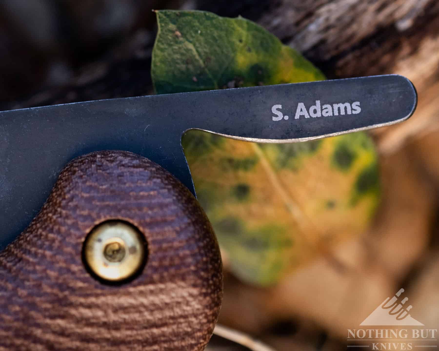 Shane Adams spent years designing this friction folder, and his first initial and last name are stamped on the back of the blade tang.