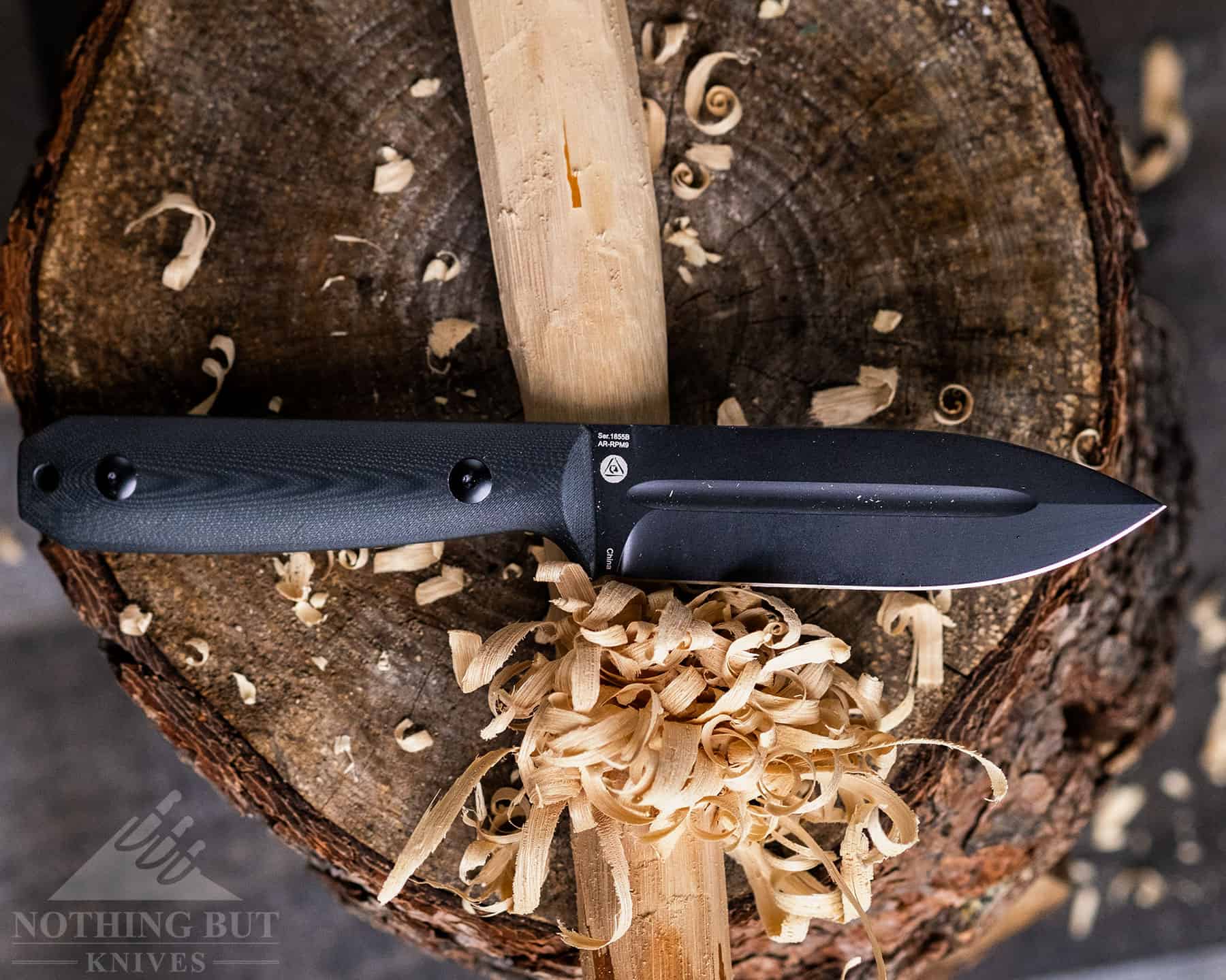 The Artisan Wreckhart does a good job with survival knife tasks like feather sticking. 