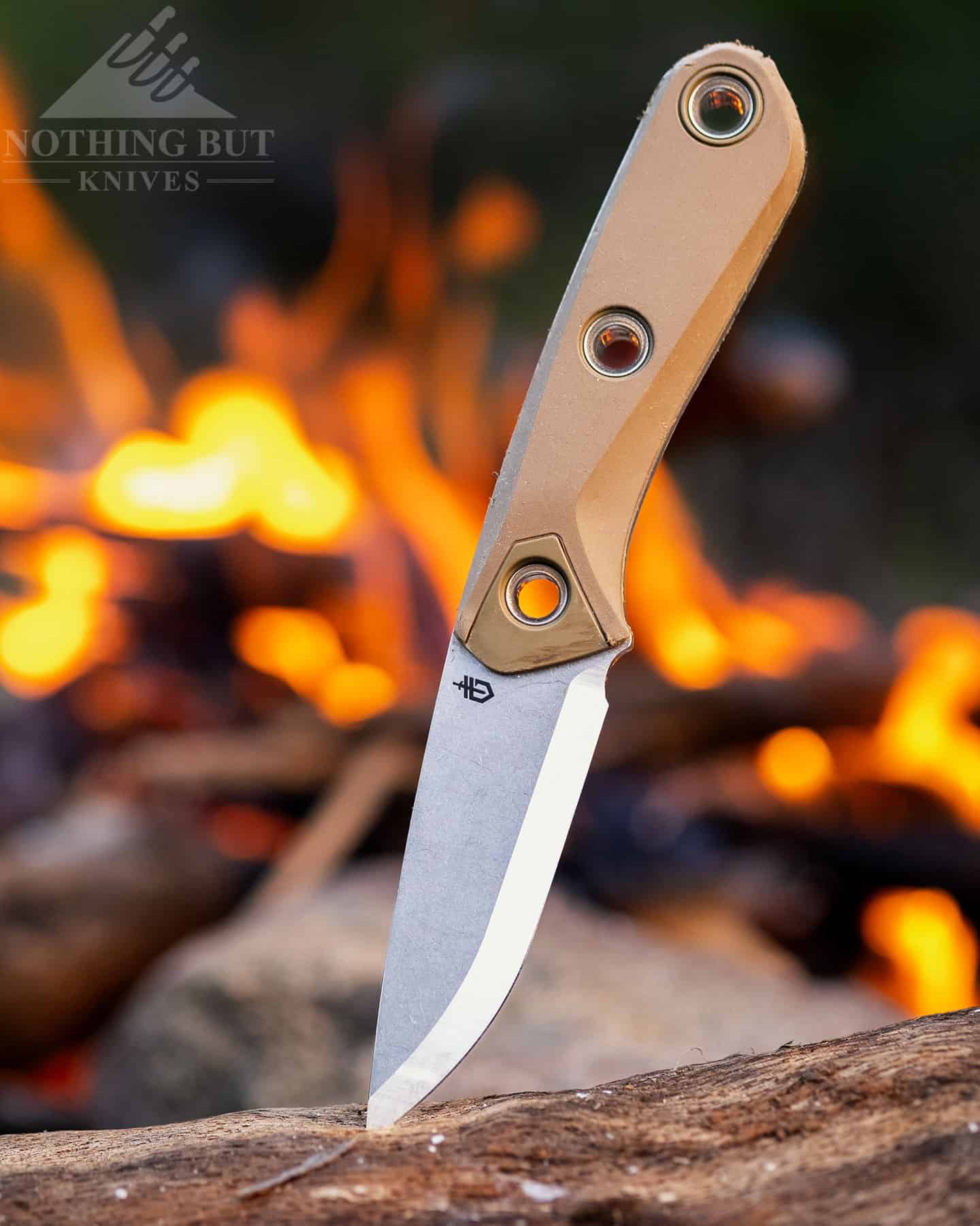 The Gerber Principle has a short blade with a scandi grind that carves up wood and throws spark like a champ.