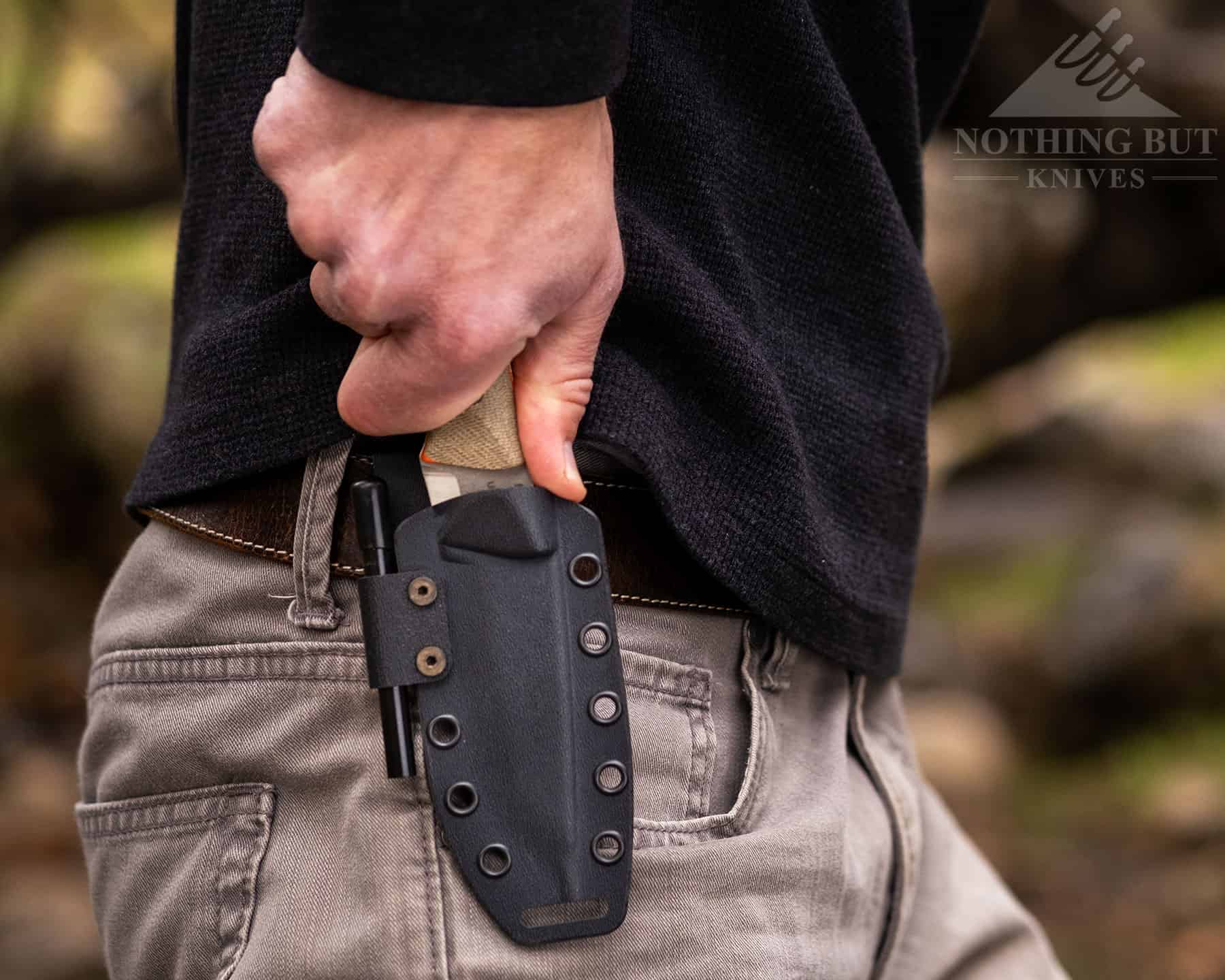 The Firecraft sheaths all have a thumb ledge for drawing the knife. This is all you need to overcome the strong hold of the sheath.