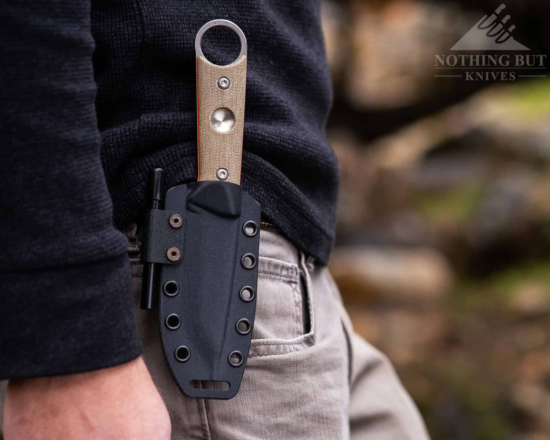 The FC-PKO's sheath is very adaptive. It has a large drain hole, a side-mounted ferro rod, and can be worn vertically or horizontally.