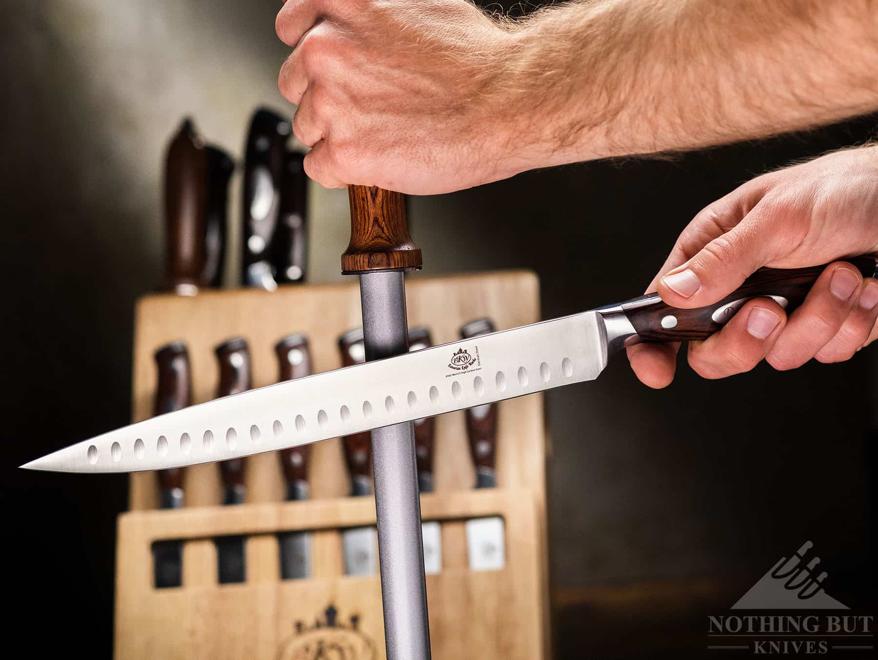 Bavarian Knife Works 19-Piece Dreamcut Set Review - Image 5 Honing the the carving knife with the honing rod that is included in the set.