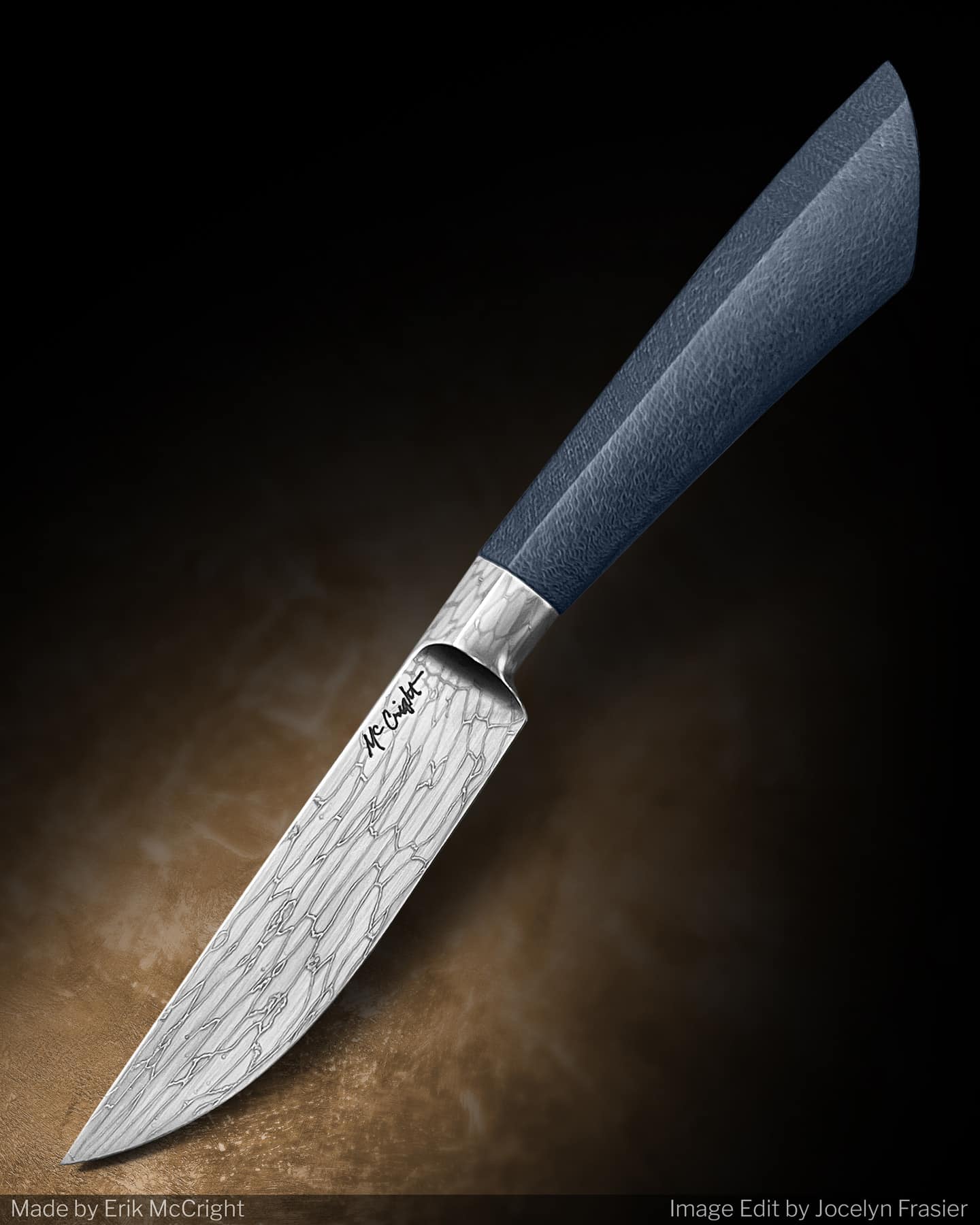 The artistry of this knife work of art features a denim G-carta handle and shattered glass Damascus steel blade.
