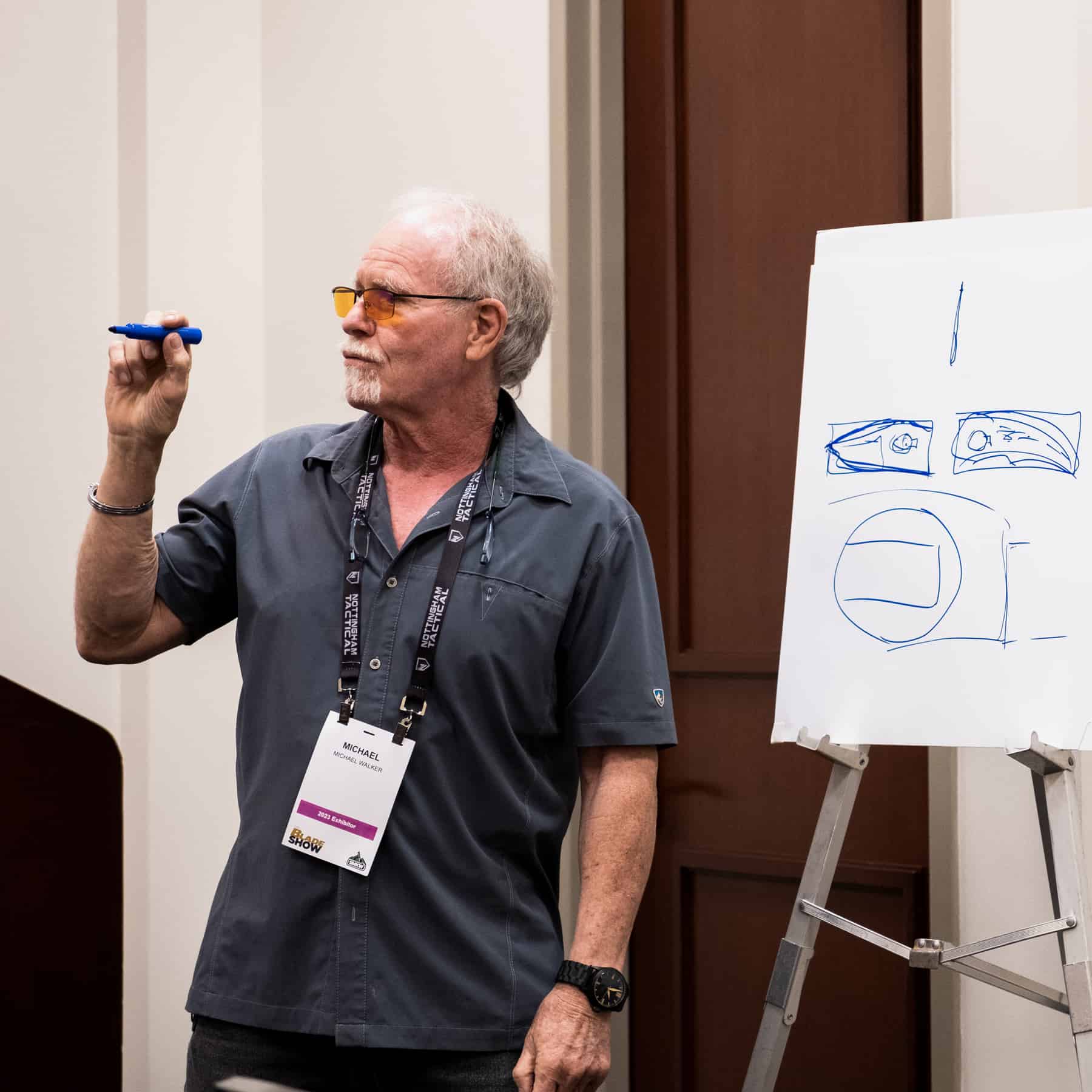 Our Incomplete Coverage Of Blade Show 2023 - Image 3 Knife designer, Michael Walker, sharing information and advice with knife makers.