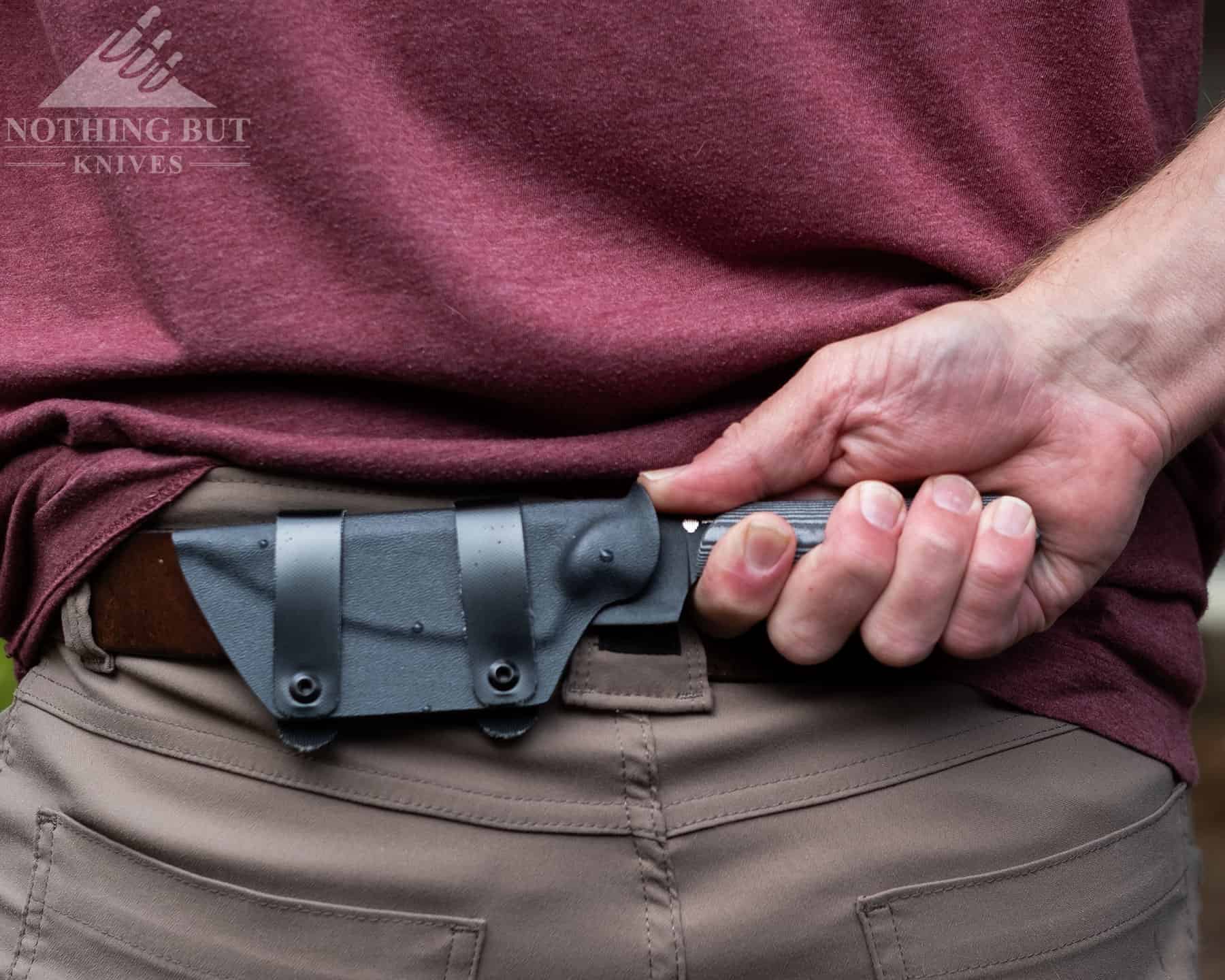 The Best D2 Steel Knives And What Makes Them Great - Image 30 The Kizer Maverick Harpoon ships with a horizontal carry only sheath that is well made and easy to use.