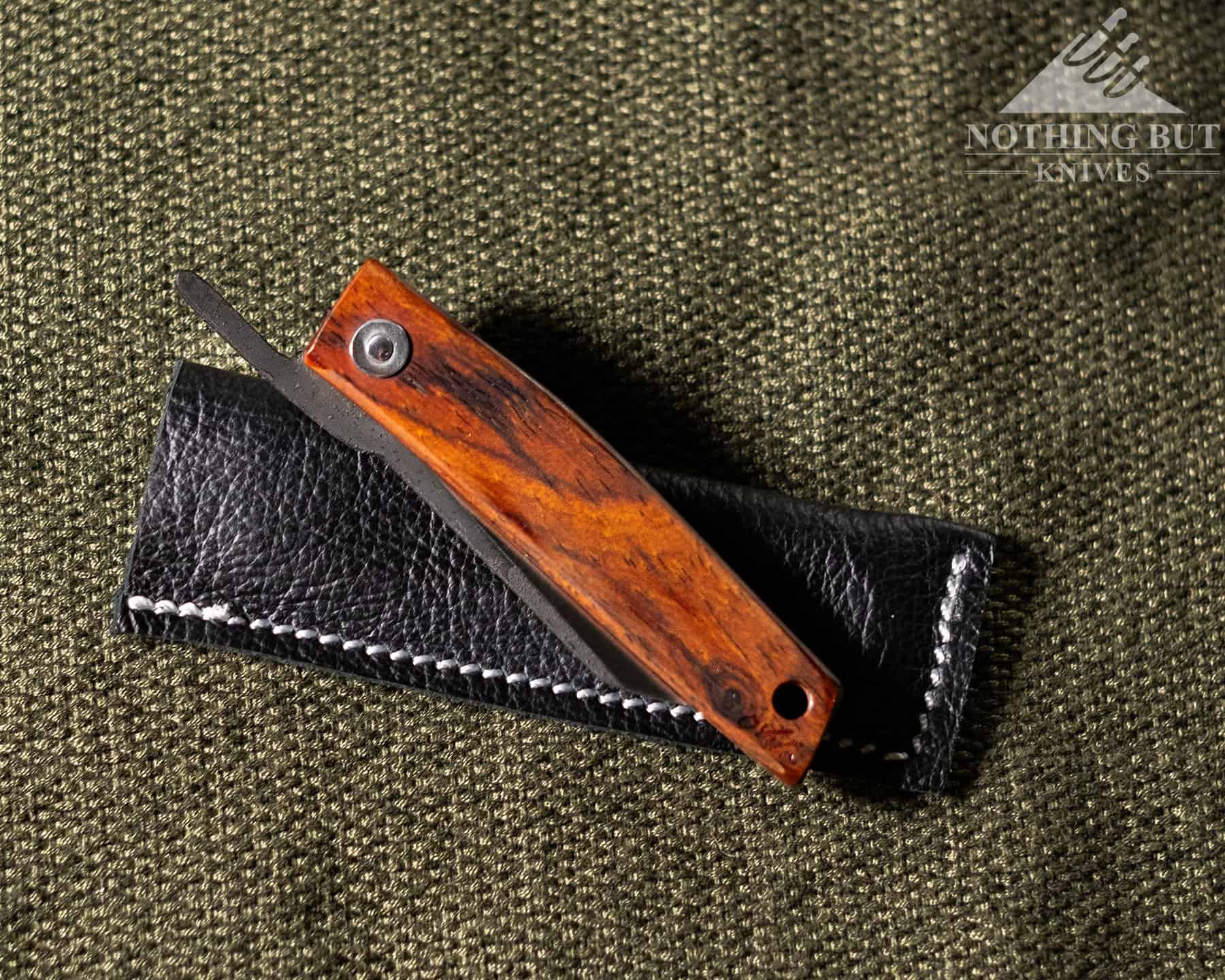 The Best D2 Steel Knives And What Makes Them Great - Image 16 The Ohta FK5 is a fun friction folder that ships with a leather pocket pouch.