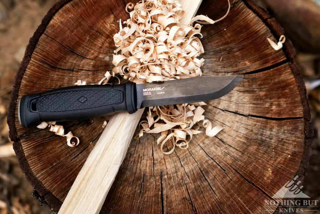 Morakniv Garberg Review - Image 12 A full feather stick and the Garberg resting on a stump.