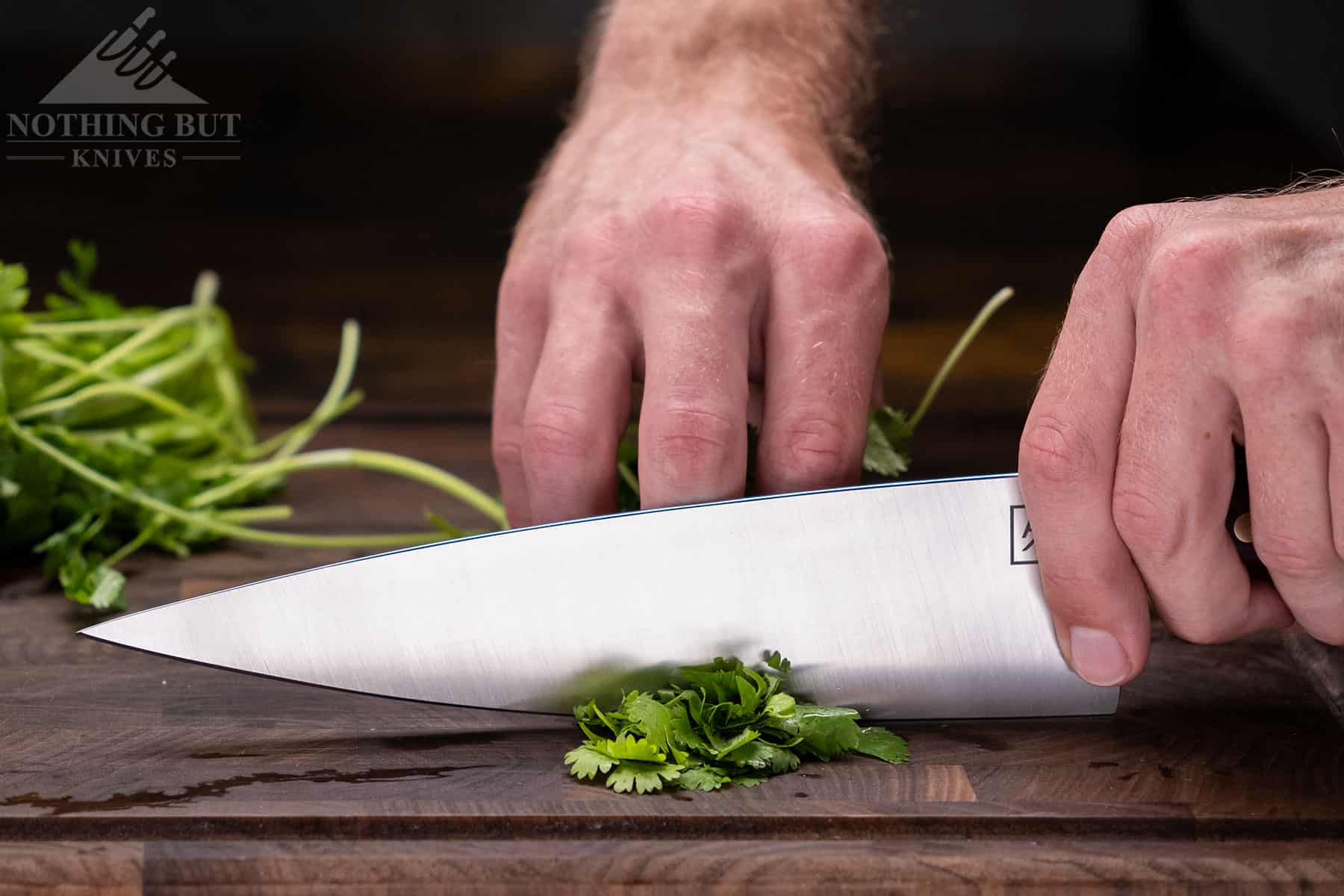Chopping grean onion with the Artisan Revere chef knife is fairly effortless, because it is thin behind the edge. 