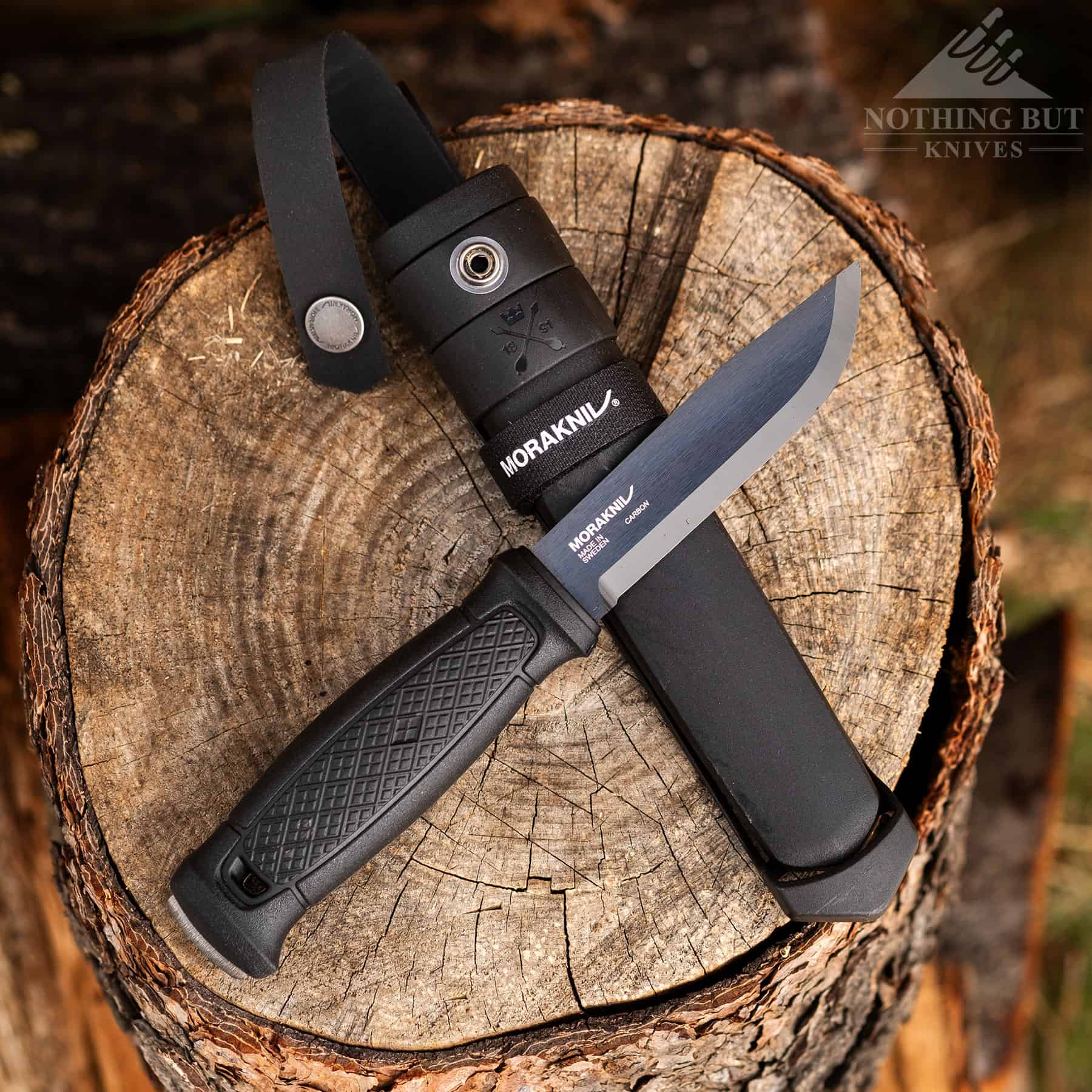 Morakniv Garberg Review - Image 1 The Morakniv Garberg on a stump with its ambidextrous sheath.