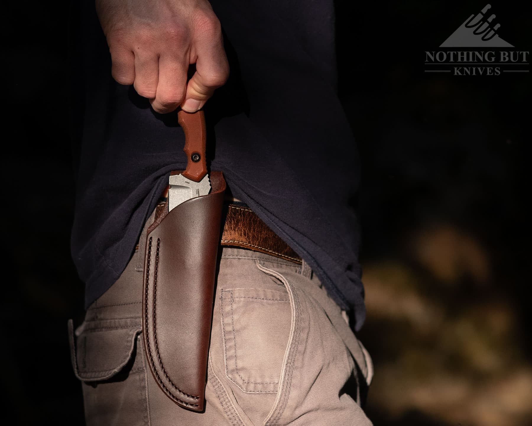 Crkt Bugsy Review - Image 4 Drawing the Bugsy from its sheath.