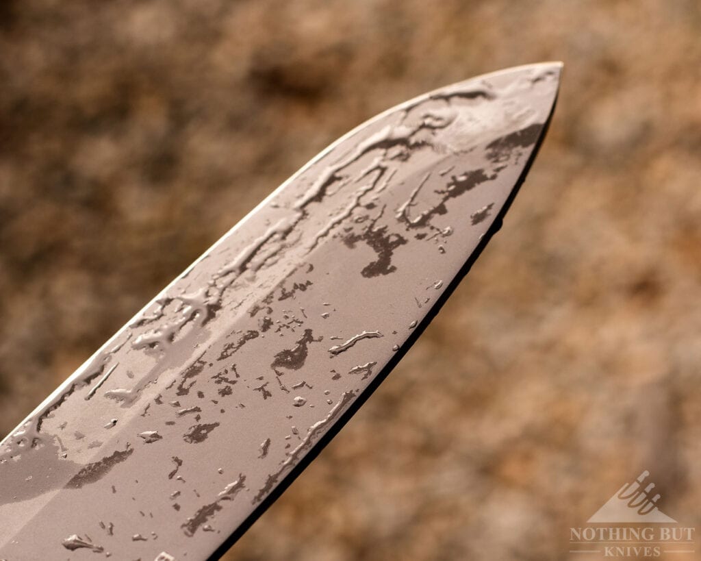 Buck Hookset cleaver with water droplets on knife showing titanium coating