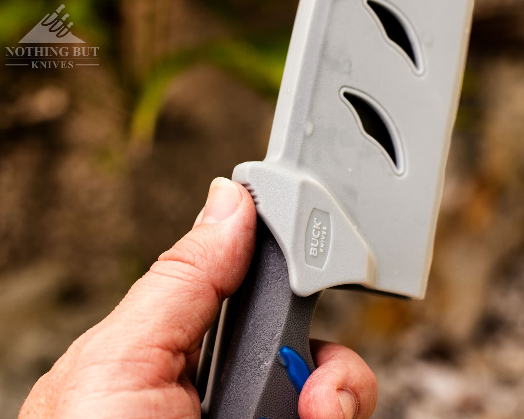Buck Hookset knife shown in sheath being held.