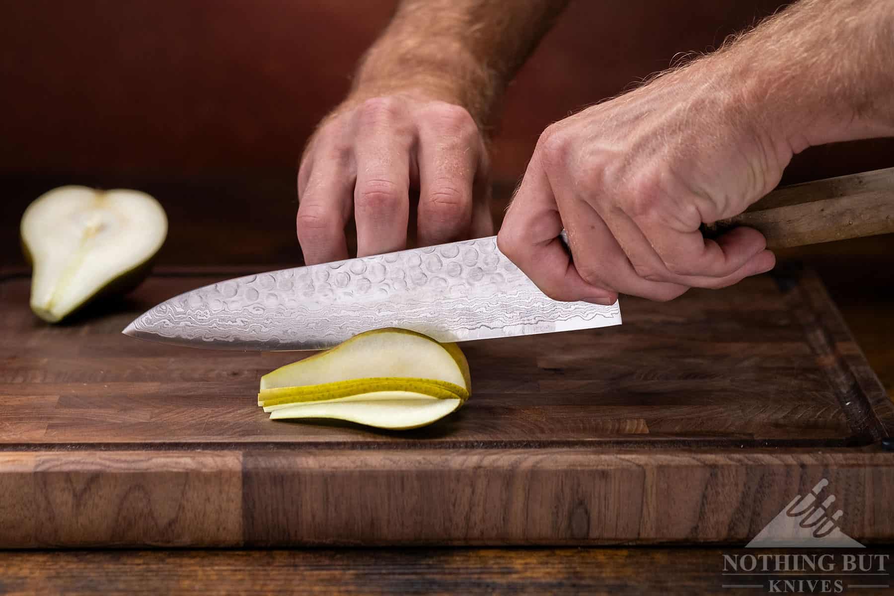 Oishya Sakai Kyuba Gyuto Chef'S Knife Review - Image 4 The Oishya gyuto blade in action slicing up a pear.