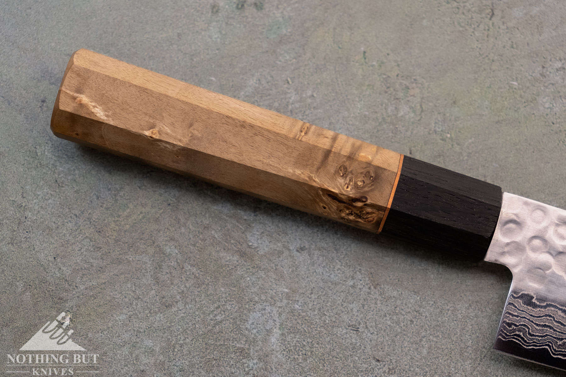 Oishya Sakai Kyuba Gyuto Chef'S Knife Review - Image 2 A close up of the maple burl handle with a bog oak collar.
