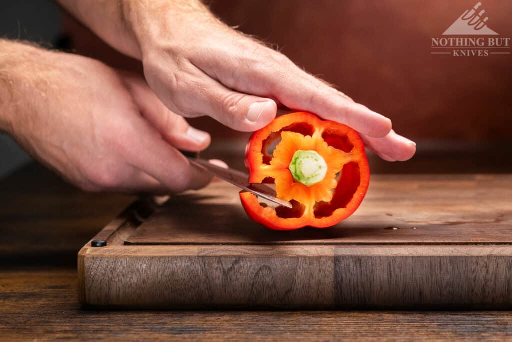 Shun Kanso Chef'S Knife Review - Image 12 Coring a pepper with the Shun Kanso 8 inch chefs knife.