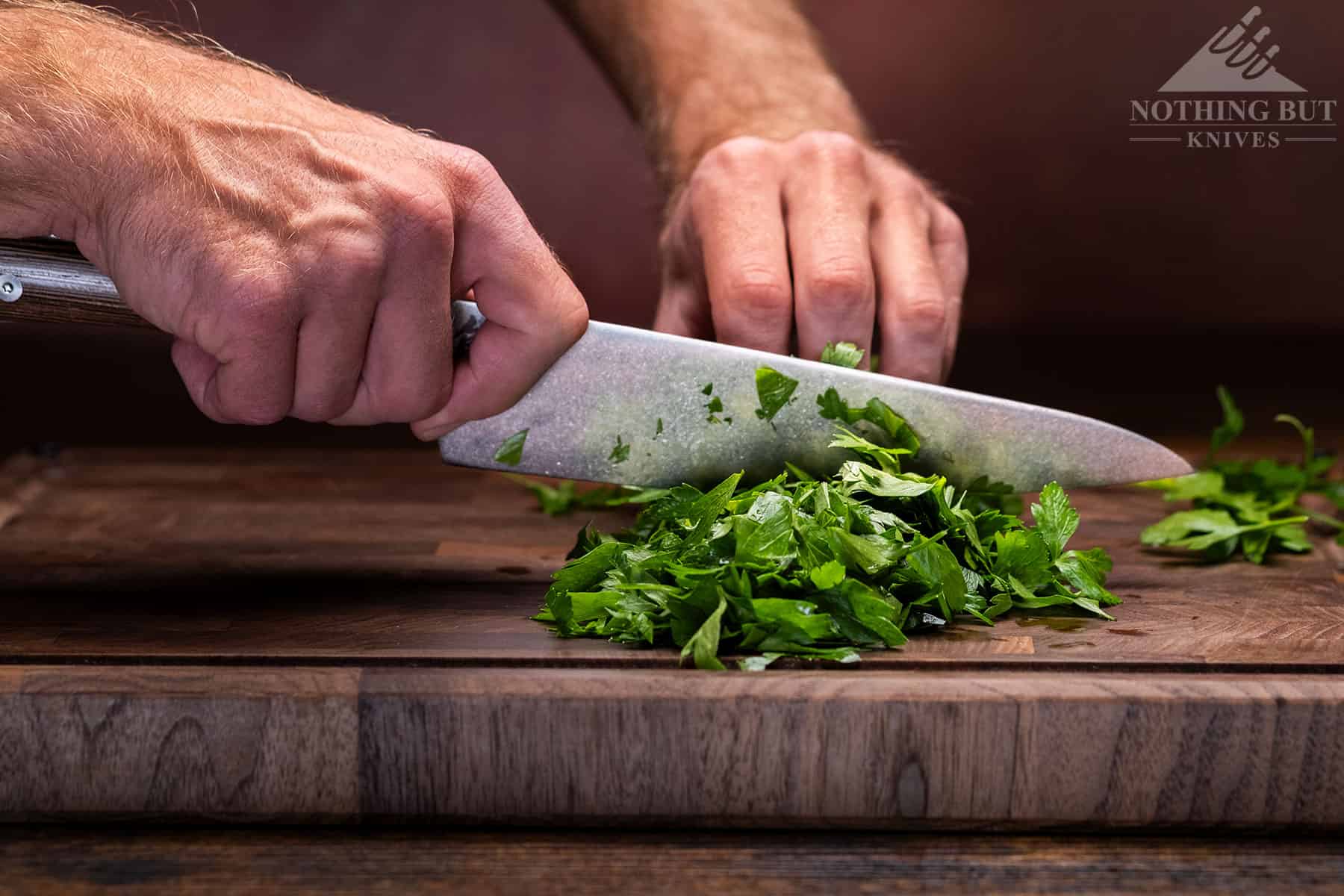 Shun Kanso Chef'S Knife Review - Image 8 Using the curve in the Kanso's edge to mince cilantro.