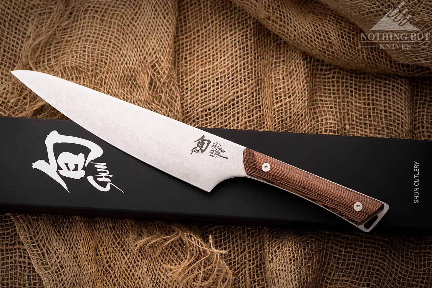 Shun Kanso Chef'S Knife Review - Image 1 The Shun Kanso looking rustic on a burlap sack.