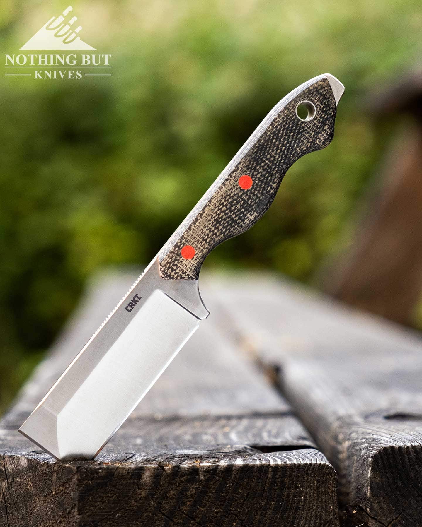 Our Favorite Fixed Blade Edc Knives And How To Carry Them - Image 14 The CRKT Razel fixed blade EDC knife shown here sticking out of an old, weathered bench outdoors.