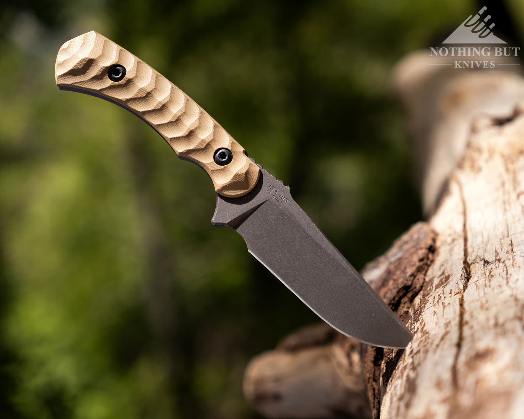 Toor Knives Brauler Review - Image 14 Toor survival style tactical knife sticking out of a log in the wilderness of the Sierra Nevada Mountains.