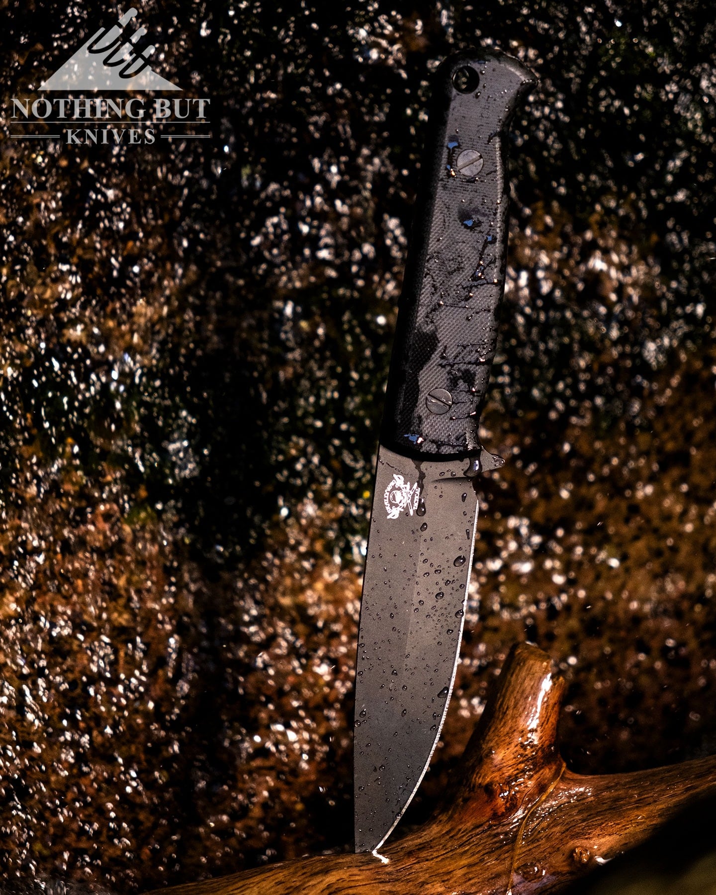 Skallywag Tactical. The Wanderer Review. - Image 10 Fixed blade knife covered in water droplets under a waterfall in a creek