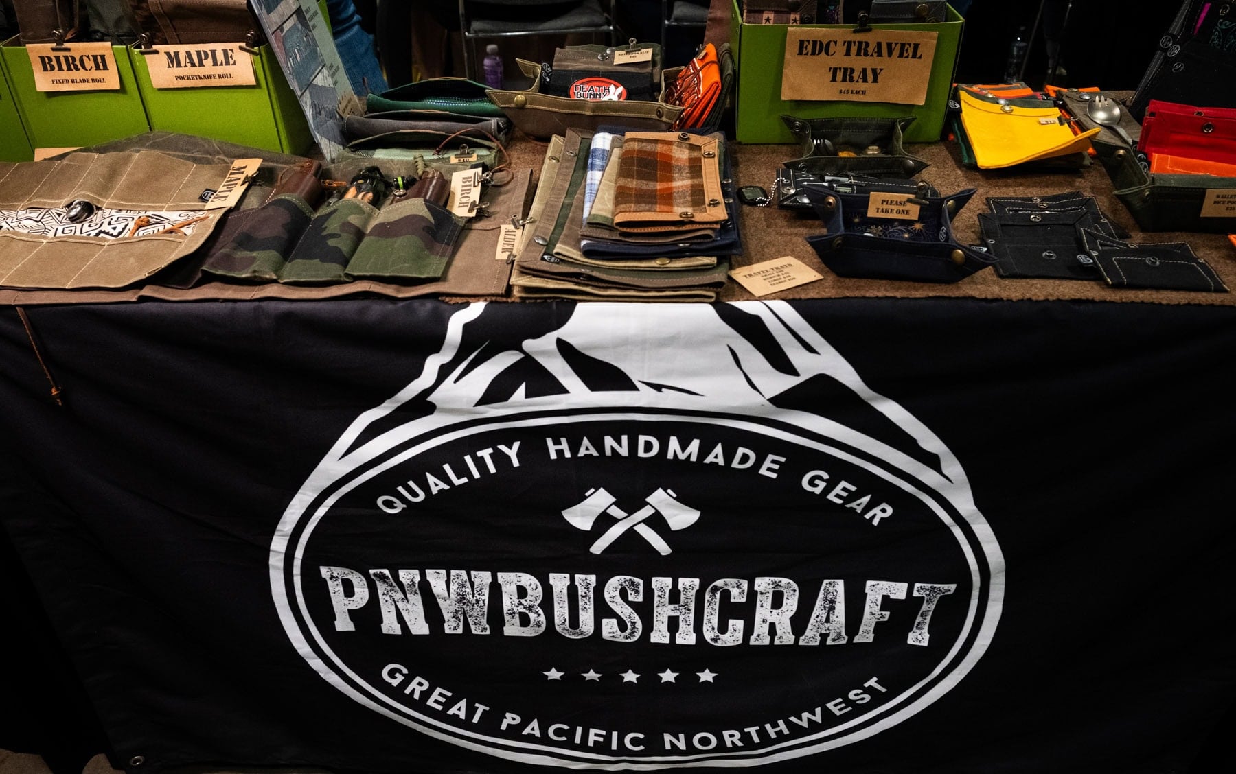 Blade Show West 2025 Wrap-Up - Image 9 The PNW Bushcraft Blade Show 2025 booth showcasing their canvas storage products.