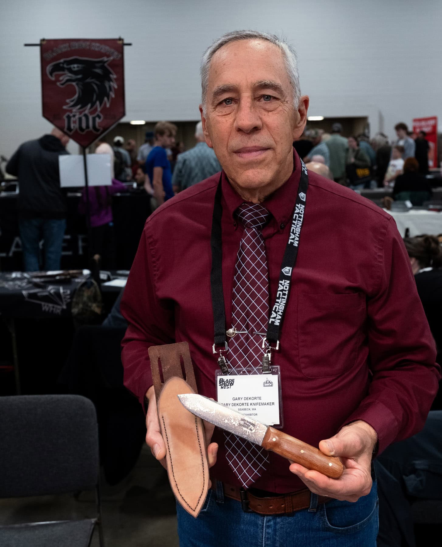 Blade Show West 2025 Wrap-Up - Image 7 Custom knifemaker, Gary DeKorte, holding his historically accurate Kephart knife at Blade Show West in 2025.