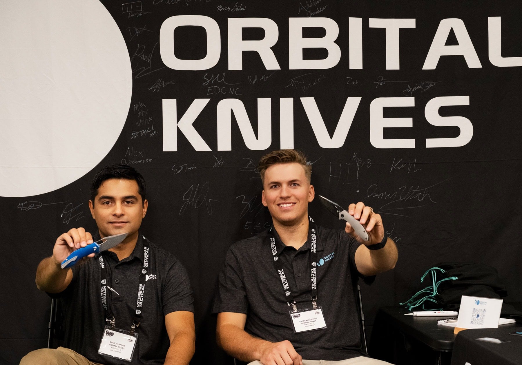 Blade Show West 2025 Wrap-Up - Image 1 Orbital Knives founders holding two of their designs at Blade Show West.