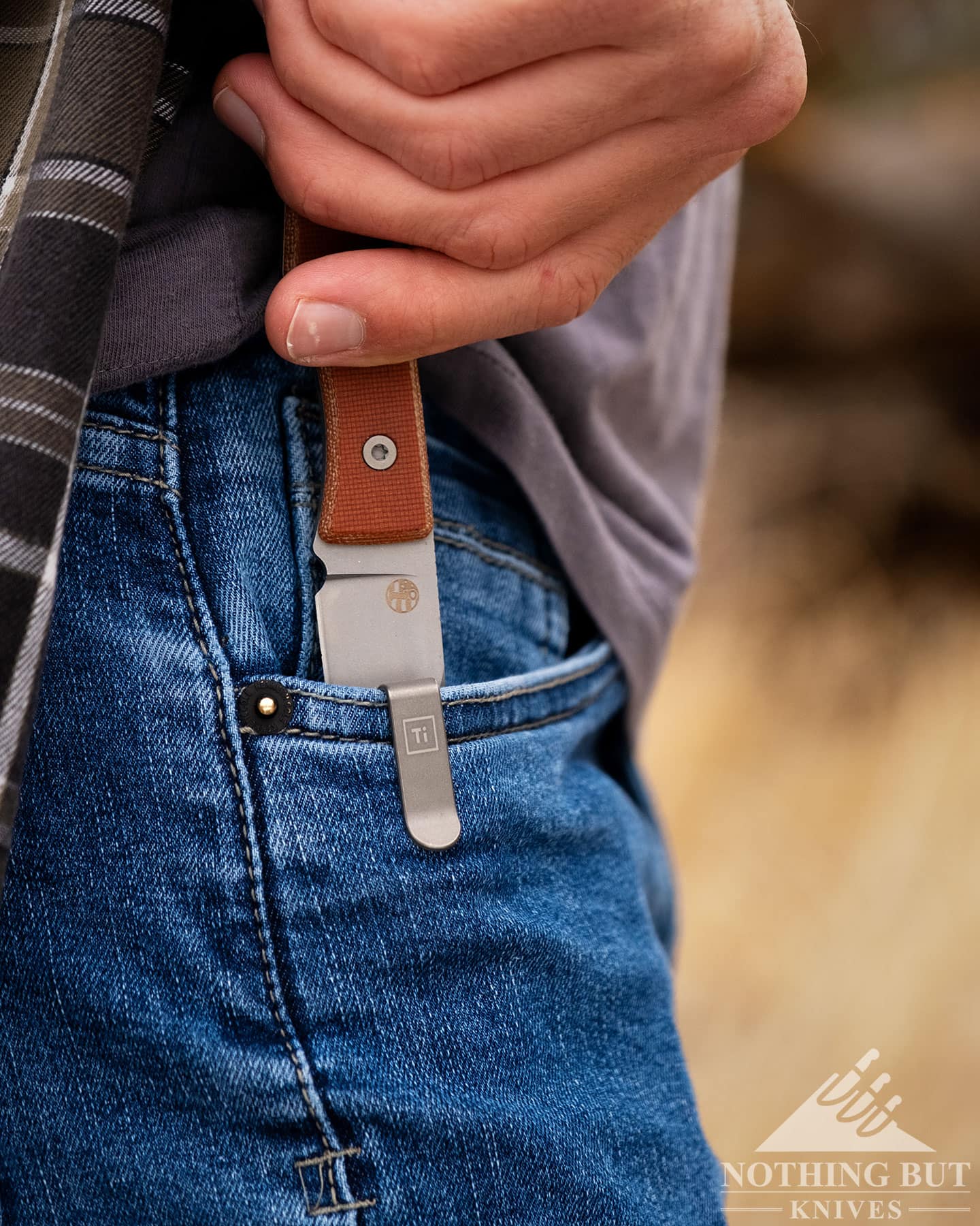 Big Idea Design Lookout Review - Image 4 The Lookout by Big Idea Design being deployed from a pocket carry in men's jeans on the right side.