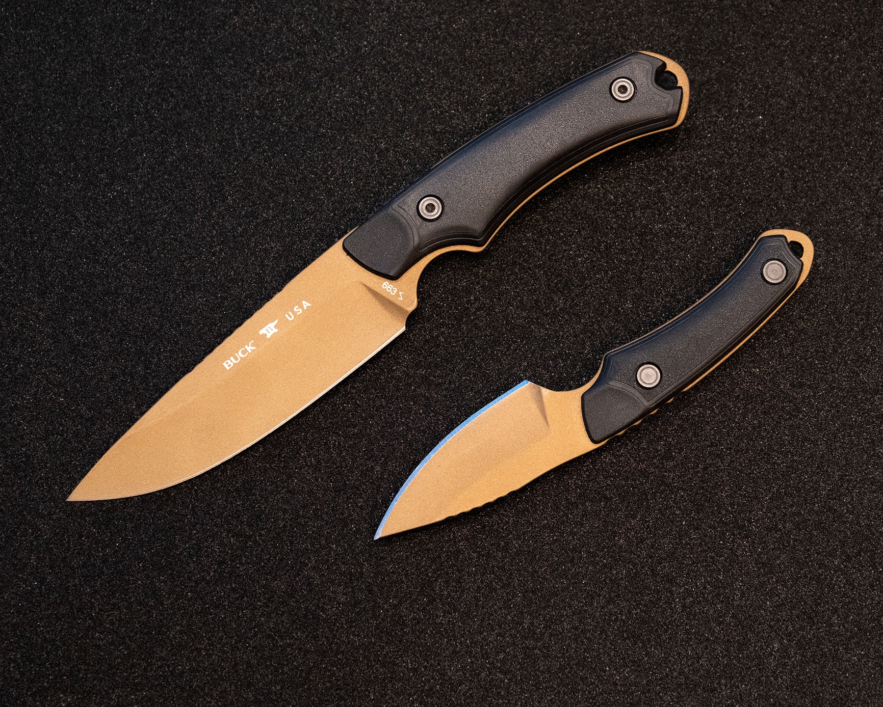 An overhead view of the two different sizes of the Buck 662 Alpha Backcountry with a bronze Cerakote blade finish. 