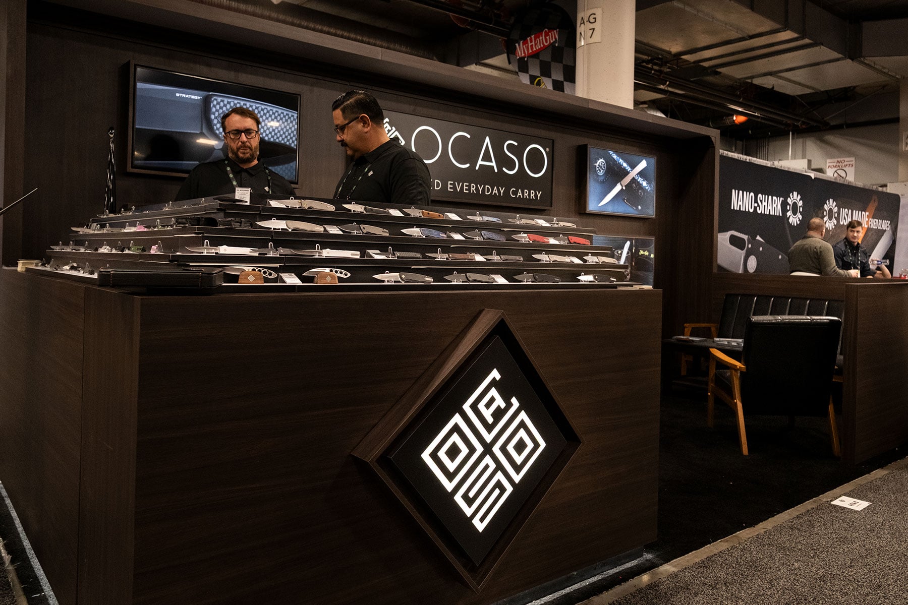 A low angle of view of the Ocaso Knives booth at SHOT Show 2026.