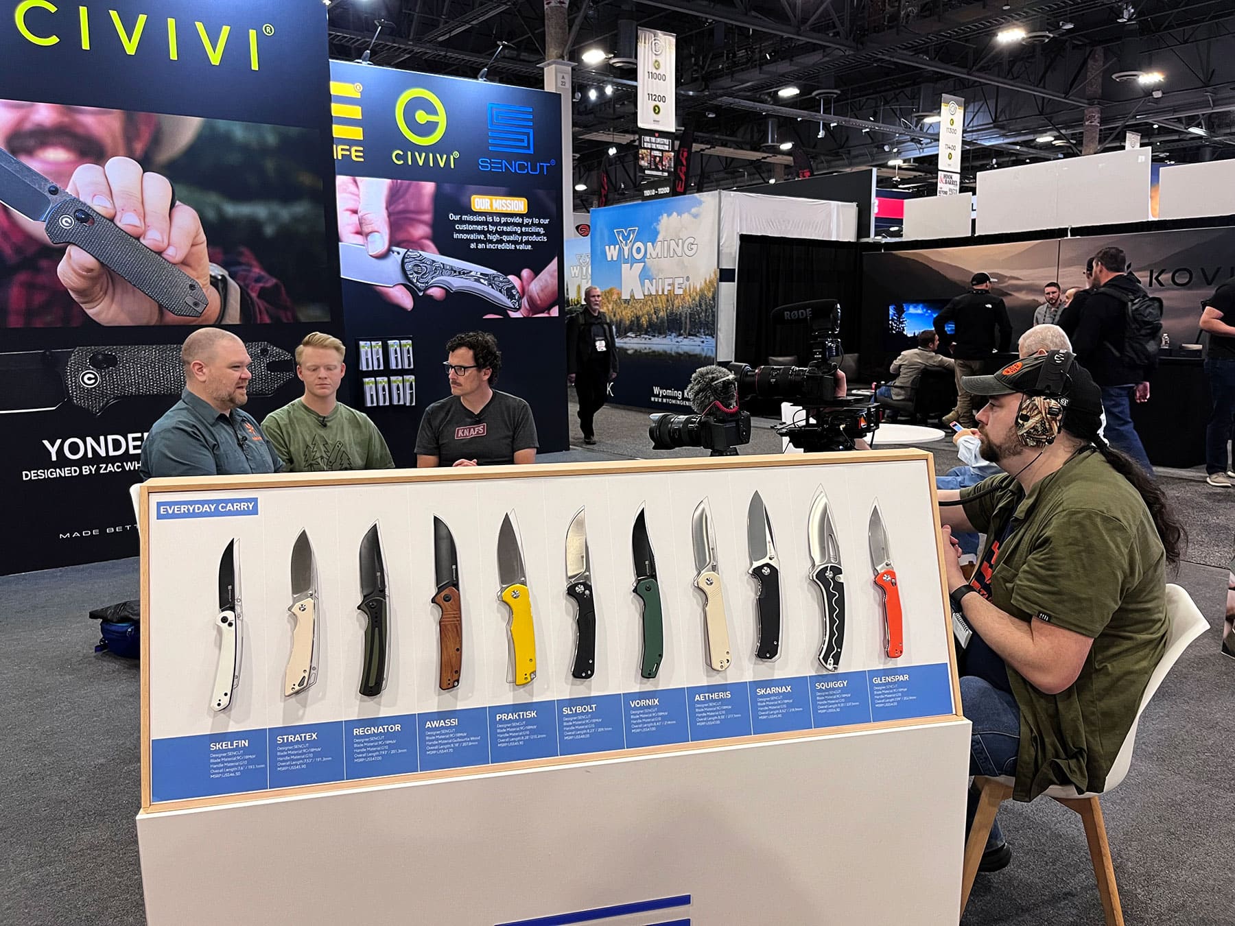 A wide angle view showing a Knifecenter video interview in progress at the SHOT Show 2026 Civivi Knives booth. 